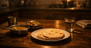 indian dining table with dal sabzi and two rotis showing silent family love