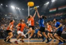 Mixed-gender korfball match in a modern Indian indoor stadium with players in action