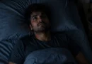 person lying awake at night overthinking insomnia india
