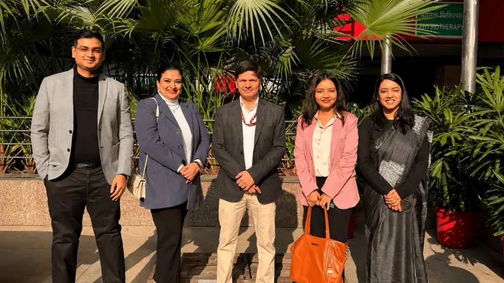 Dr. Ishtpreet Mann with colleagues and healthcare team