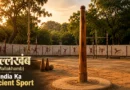 Traditional Mallakhamb wooden pole in Indian akhada training ground during golden hour