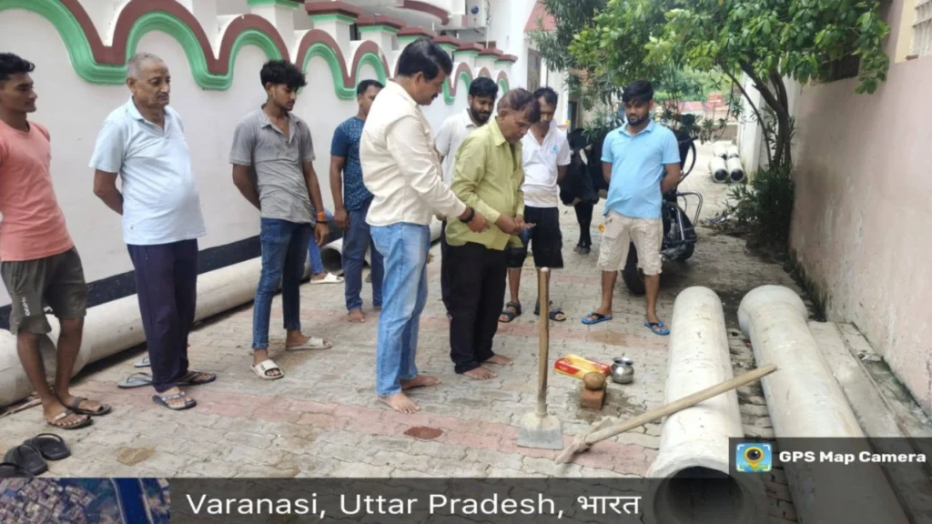 Rajendra Yadav inspecting sewer infrastructure work with officials and residents