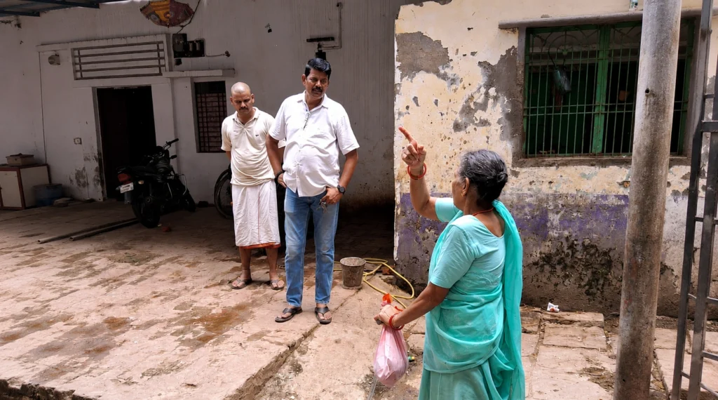 Rajendra Yadav listening to an elderly resident during a ward visit in Varanasi