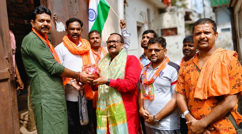 Tilak Raj Mishra with people during a community interaction